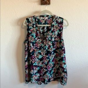 Black Sleeveless blouse with flower pattern.